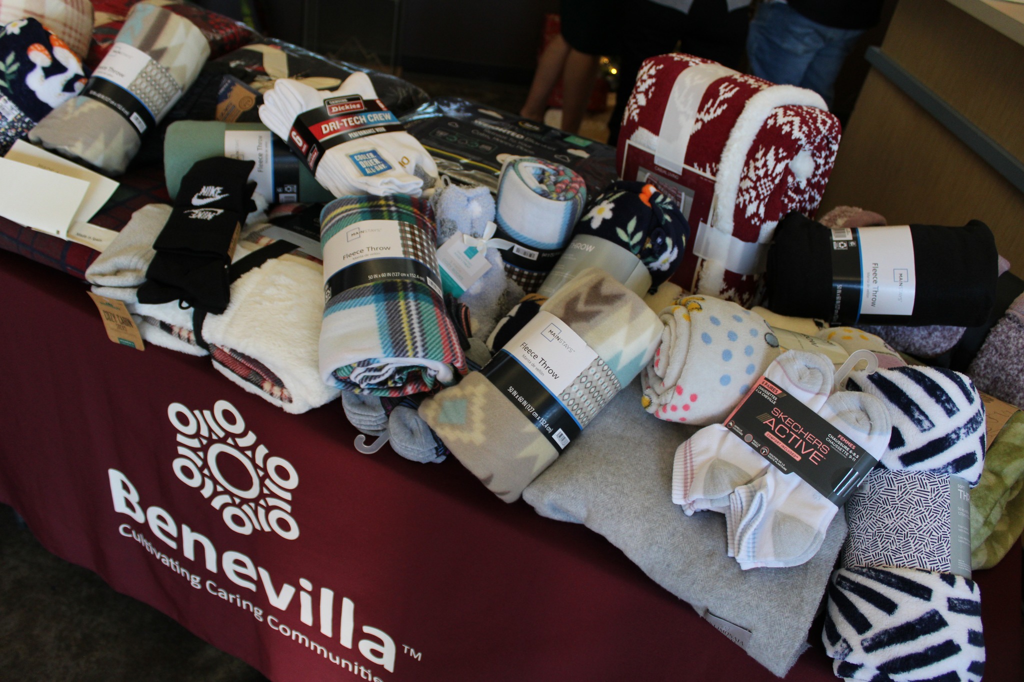 Table with donated socks and blankets