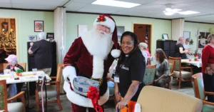 Santa visits Benevilla’s West Valley Life Enrichment Program during the Crescendo Choir holiday celebration, sharing smiles with staff and participants