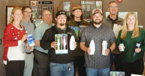 Wyyerd Fiber employees and community partners hold donated hygiene items collected for Benevilla to support local seniors